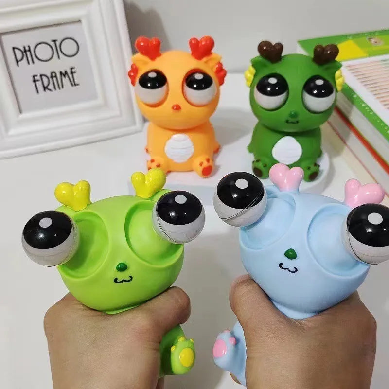 Juguete de descompresión de dinosaurio dragón de ojo explosivo creativo, juguete sensorial de animales de liberación divertida para exprimir alegría