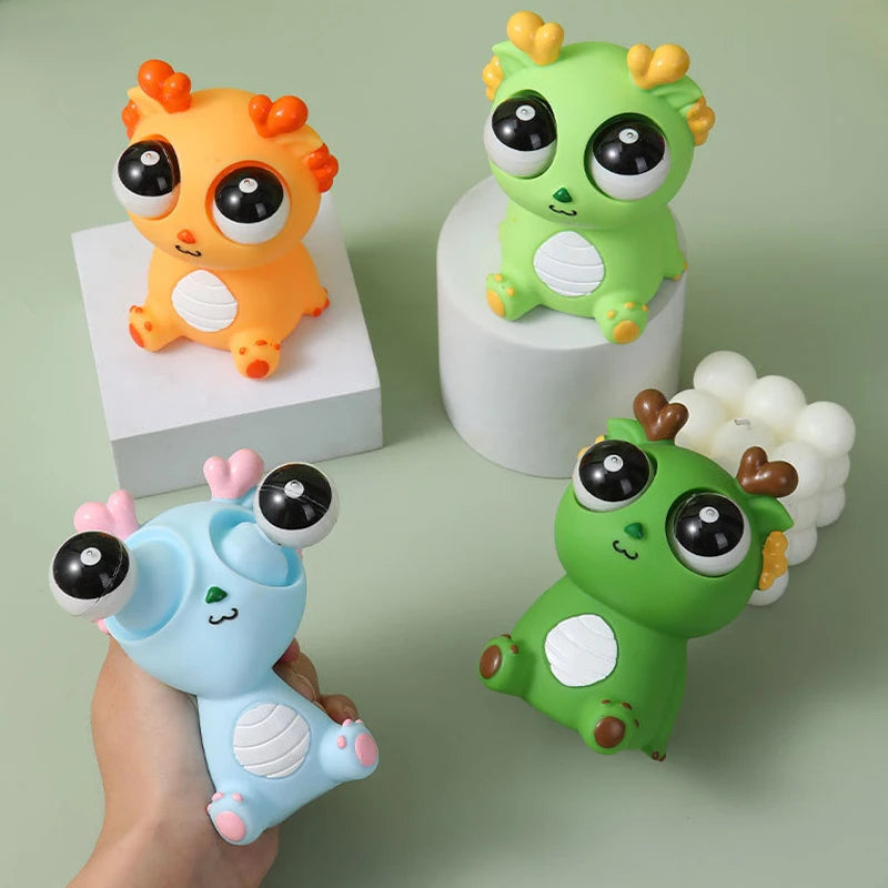 Juguete de descompresión de dinosaurio dragón de ojo explosivo creativo, juguete sensorial de animales de liberación divertida para exprimir alegría